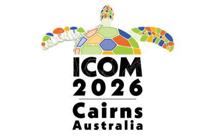 Logo for ICOM2026 featuring a colorful mosaic sea turtle alongside bold black text reading "ICOM 2026 Cairns Australia". Abstract coral and marine plant designs in green, orange, yellow, and blue decorate the background.